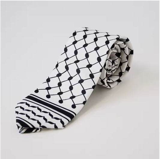 Black and white keffiyeh inspired tie on a light background
