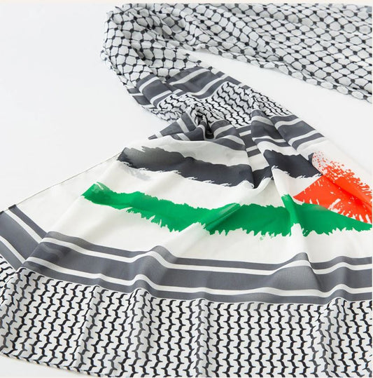 Folded fabric with geometric patterns and colorful accents on a white background